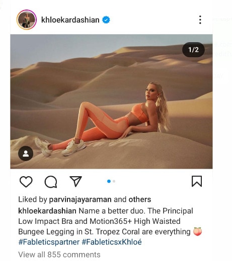 Khloé  Kardashian dressed in orange activewear from Fabletics